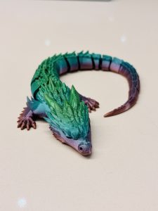 Luna the Sleepy Dragon articulated flexi dragon toy curled in a spiral pose