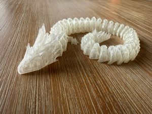 Close-up of Frostbite the Ice Crystal Dragon's clear 3D printed segments